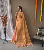 Peach woven design zari tissue saree with unstitched blouse piece