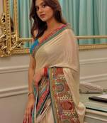 Cream ethnic motifs satin saree