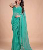 Sea green embellished sequinned pure chiffon heavy work saree
