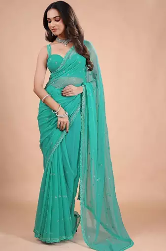 Sea green embellished sequinned pure chiffon heavy work saree