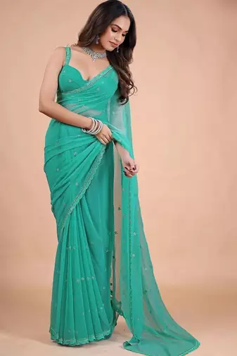 Sea green embellished sequinned pure chiffon heavy work saree