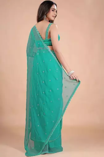 Sea green embellished sequinned pure chiffon heavy work saree
