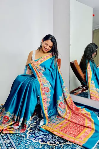 Teal ethnic motifs satin saree
