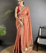 Orange woven design zari silk blend heavy work bandhani saree