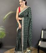 Green bandhani embroidered silk blend heavy work bandhani saree