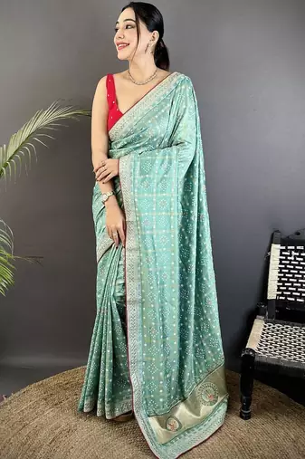 Teal ethnic motifs sequinned silk blend bandhani saree