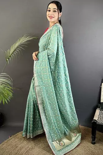 Teal ethnic motifs sequinned silk blend bandhani saree