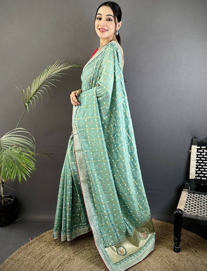Teal ethnic motifs sequinned silk blend bandhani saree