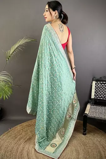 Teal ethnic motifs sequinned silk blend bandhani saree