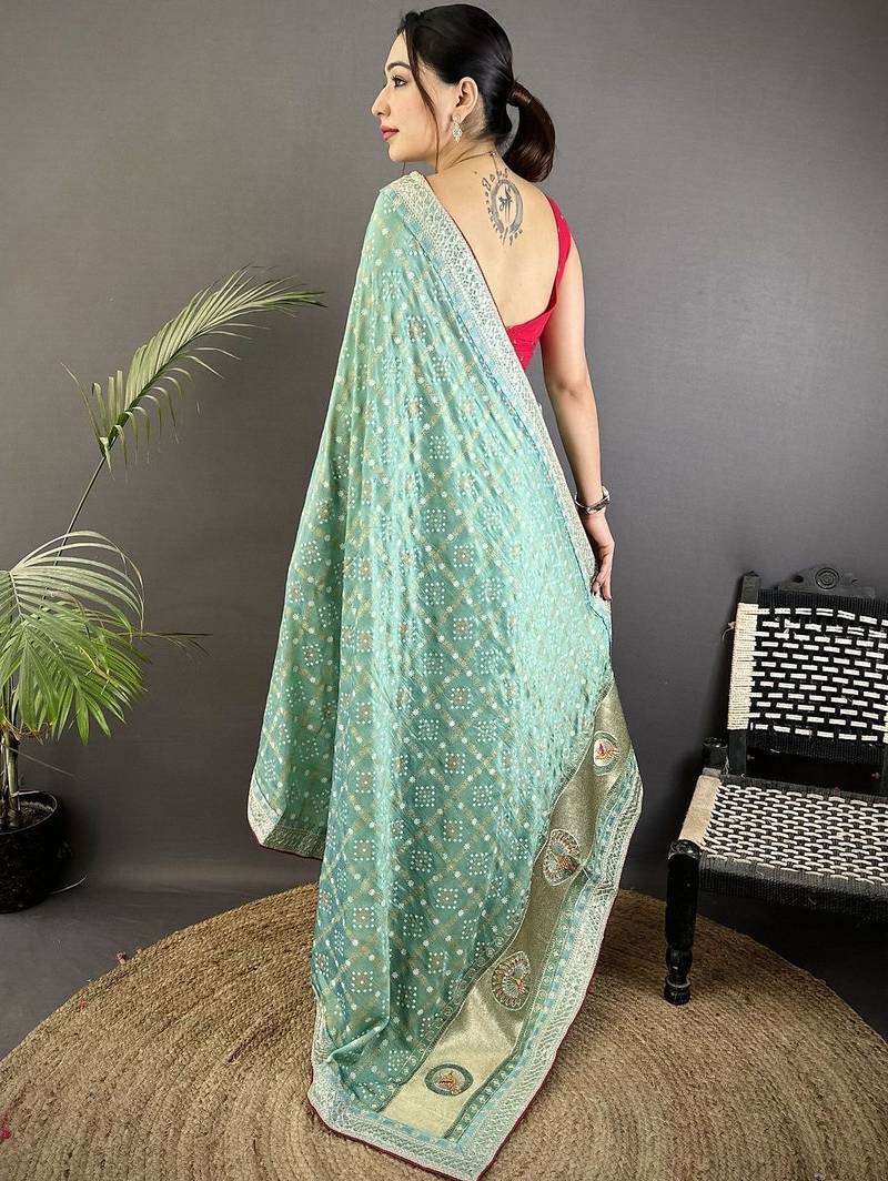 Teal ethnic motifs sequinned silk blend bandhani saree