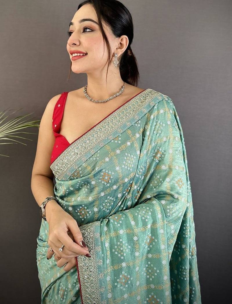 Teal ethnic motifs sequinned silk blend bandhani saree