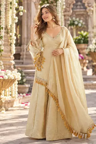 Beige silk blend readymade suit with mirror & border work