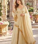 Beige silk blend readymade suit with mirror & border work