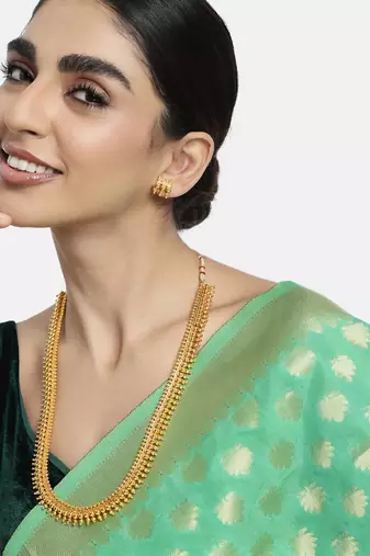 Women's gold toned long maharani haar necklace with earrings south style
