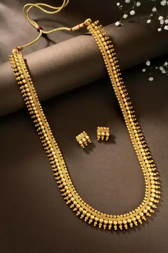 Women's gold toned long maharani haar necklace with earrings south style