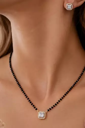 Women's golden toned square solitaire mangalsutra & stud earring  set