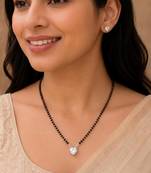 Women's silver toned heart solitaire mangalsutra & stud earring set