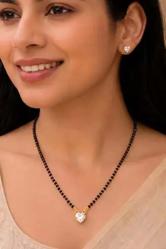 Women's golden toned heart solitaire mangalsutra & stud earring set