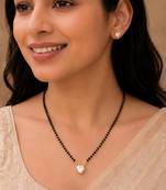 Women's golden toned heart solitaire mangalsutra & stud earring set