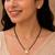 Women's golden toned heart solitaire mangalsutra & stud earring set