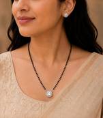 Silver toned round solitaire black beaded mangalsutra with earrings