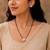 Silver toned round solitaire black beaded mangalsutra with earrings