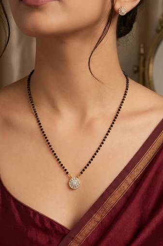 Women's golden toned floral mangalsutra & stud earring jewelry set