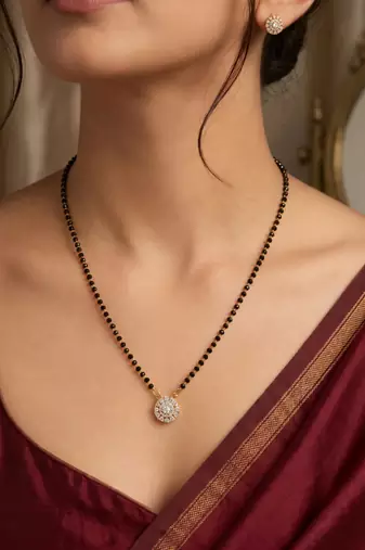 Women's golden toned floral mangalsutra & stud earring jewelry set