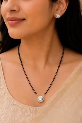 Round solitaire design black beaded mangalsutra with stud earrings