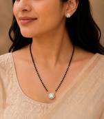 Round solitaire design black beaded mangalsutra with stud earrings