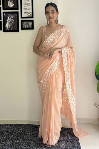 Peach ethnic motifs embroidered sequinned saree