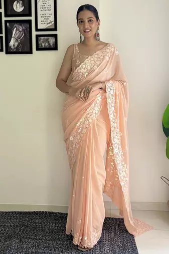 Peach ethnic motifs embroidered sequinned saree