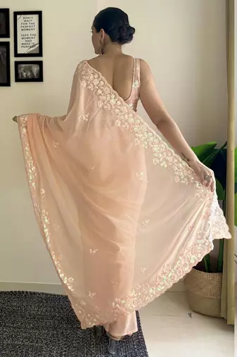 Peach ethnic motifs embroidered sequinned saree