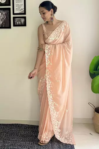 Peach ethnic motifs embroidered sequinned saree