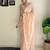 Peach ethnic motifs embroidered sequinned saree