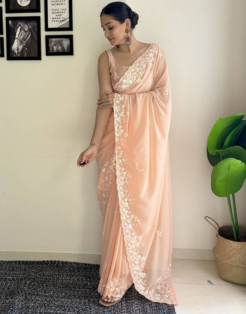 Peach ethnic motifs embroidered sequinned saree