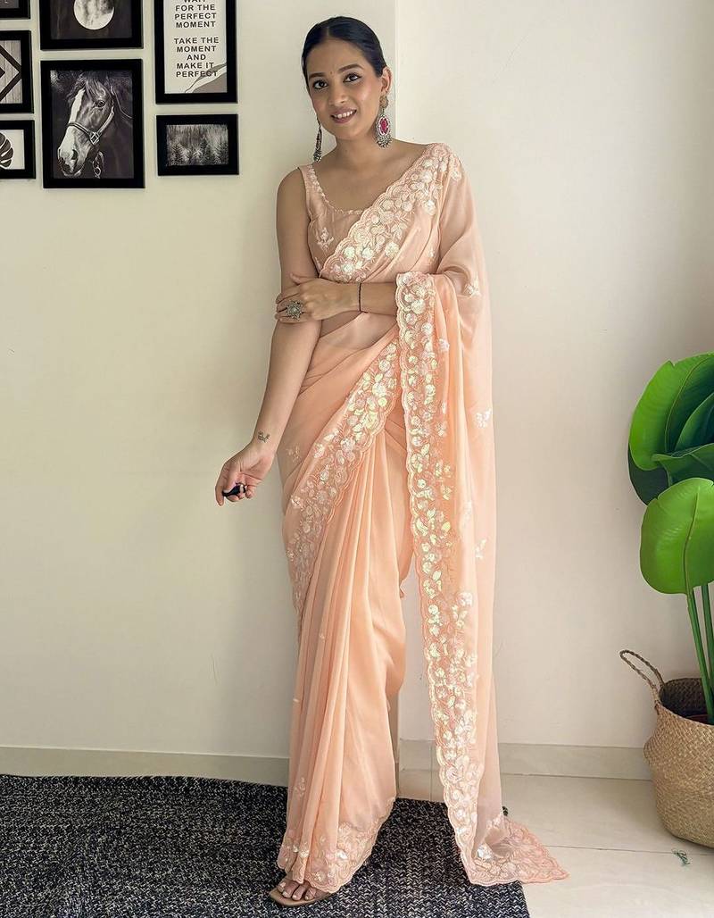 Peach ethnic motifs embroidered sequinned saree