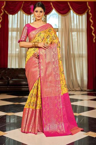 Yellow ethnic motifs woven design zari banarasi saree