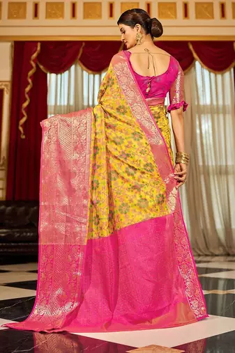 Yellow ethnic motifs woven design zari banarasi saree