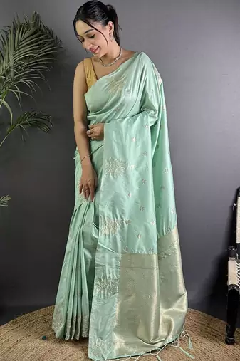 Sea green woven design soft lichi silk saree with flower weaving and matching blouse piece