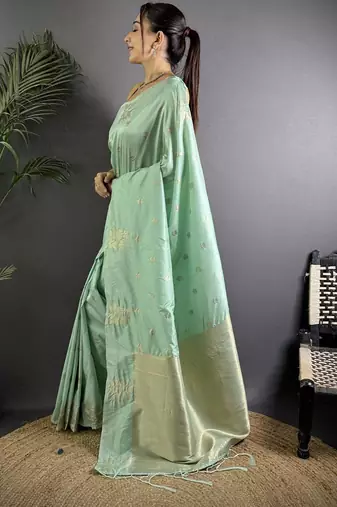Sea green woven design soft lichi silk saree with flower weaving and matching blouse piece