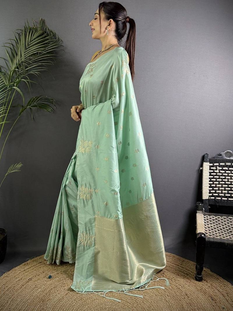 Sea green woven design soft lichi silk saree with flower weaving and matching blouse piece