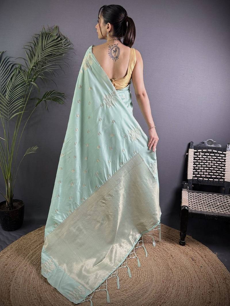 Sea green woven design soft lichi silk saree with flower weaving and matching blouse piece