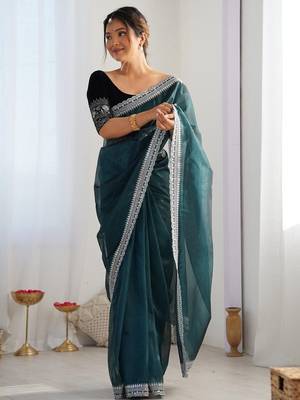 Teal sequinned net saree with blouse piece 1