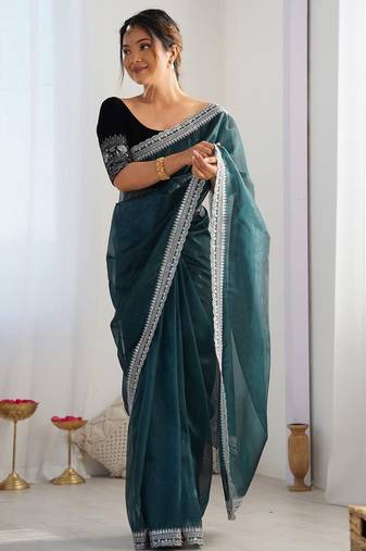 Teal sequinned net saree with blouse piece