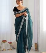 Teal sequinned net saree with blouse piece