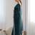 Teal sequinned net saree with blouse piece