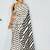 Off white polka dot satin block print saree