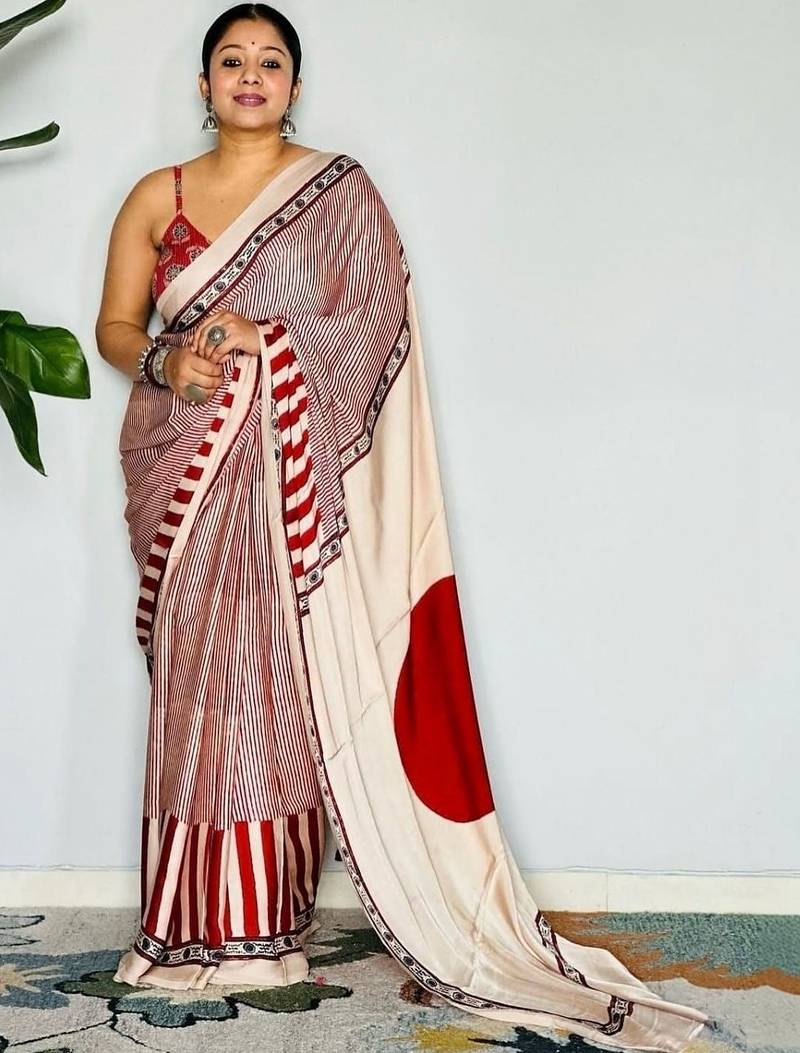Cream striped satin block print saree