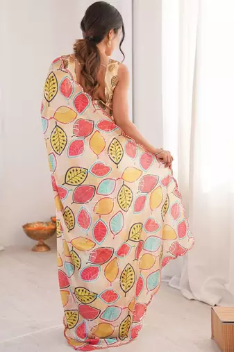 Cream floral mirror work pure chiffon ikat saree